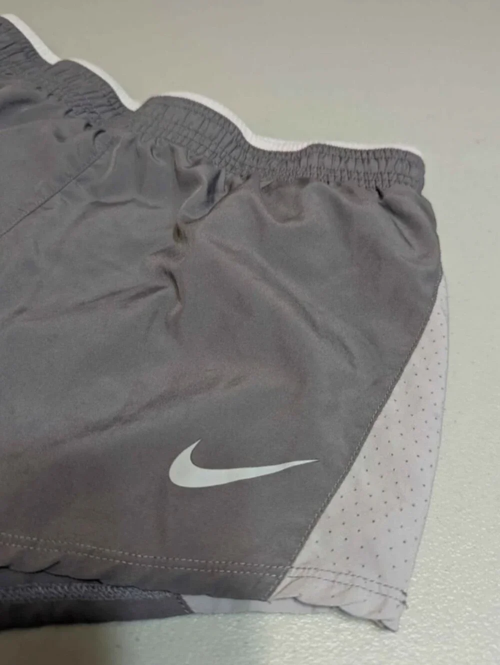 Women's small gray and white Nike shorts